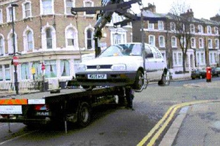 Illustration for article titled Car Towed After Contractor Lifts Car, Paints Stripes